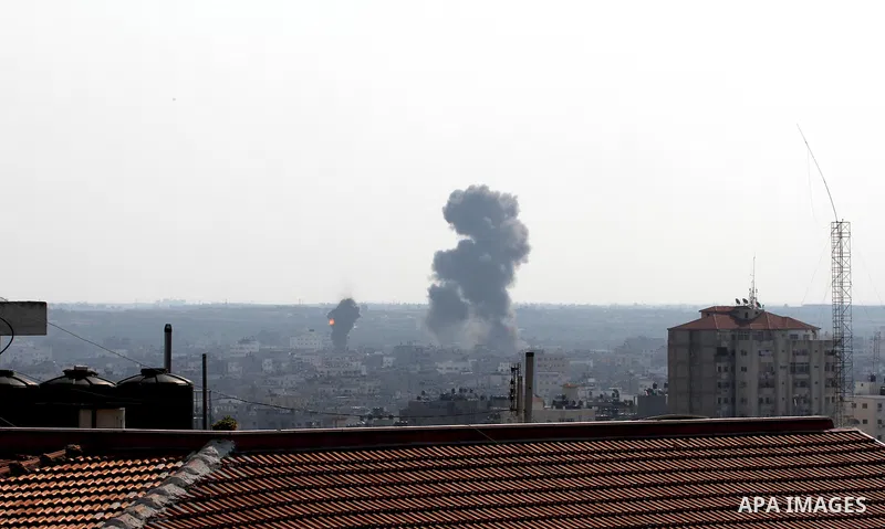 Smoke rises after an Israeli air strike in Gaza city Nov. 15, 2012. The Israeli air force continued striking Hamas targets in the Gaza Strip on Wednesday, after killing 10 people, including al-Jaabari and at least five c...