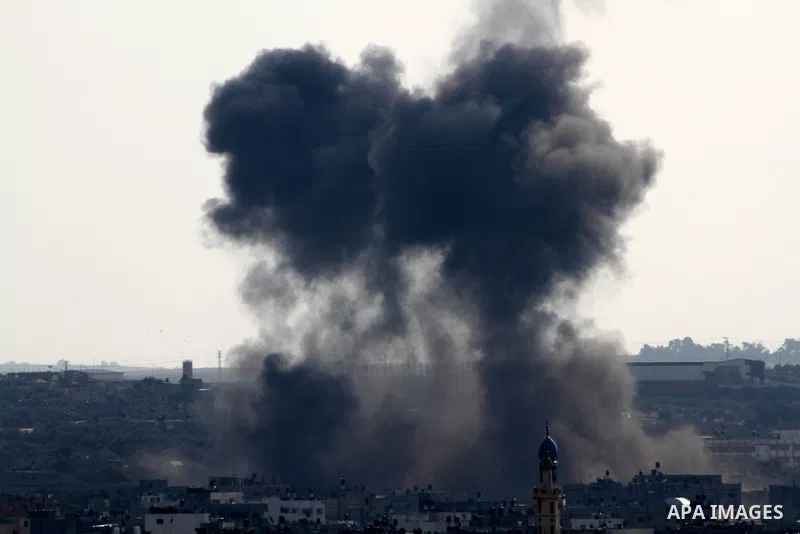 Smoke rises after an Israeli air strike in Gaza city Nov. 15, 2012. The Israeli air force continued striking Hamas targets in the Gaza Strip on Wednesday, after killing 10 people, including al-Jaabari and at least five c...