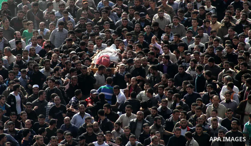 Palestinian mourners carry the body of Ahmad Jaabari, head of the military wing of the Hamas movement, the Ezzedin Qassam Brigades, during his funeral in Gaza City, on November 15, 2012. Tensions between Israel and Gaza...