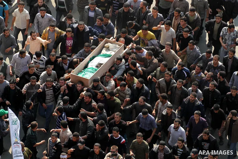 Palestinian mourners carry the body of Ahmad Jaabari, head of the military wing of the Hamas movement, the Ezzedin Qassam Brigades, during his funeral in Gaza City, on November 15, 2012. Tensions between Israel and Gaza...