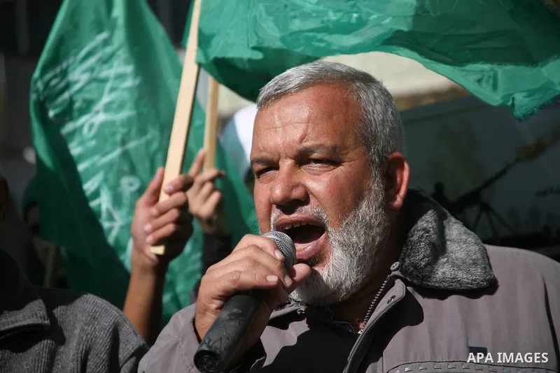 Palestinian Hamas supporters march during a demonstration in support of the people of the Gaza Strip and against Israeli air strikes in the West Bank city of Hebron on November 15, 2012 . Several Palestinians were killed...