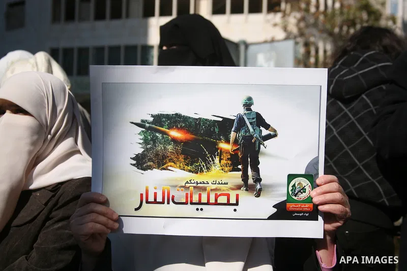 Palestinian Hamas supporters march during a demonstration in support of the people of the Gaza Strip and against Israeli air strikes in the West Bank city of Hebron on November 15, 2012 . Several Palestinians were killed...