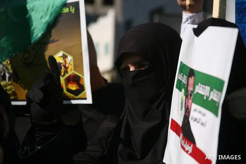 Palestinian Hamas supporters march during a demonstration in support of the people of the Gaza Strip and against Israeli air strikes in the West Bank city of Hebron on November 15, 2012 . Several Palestinians were killed...
