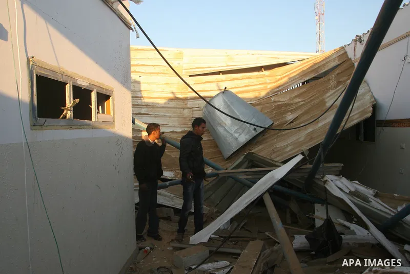 Palestinians inspect the damage in their house hit by a missile fired by Israeli air forces in the southern of Gaza strip town of Rafah, November 15, 2012. Several Palestinians were killed following a series of Israel's...