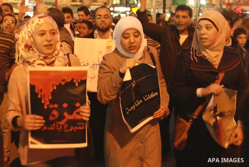 Palestinian activists hold placards during a protest against the Israeli military operations in Gaza strip, in the West Bank city of Nablus on November 15, 2012. Several Palestinians were killed following a series of Isr...