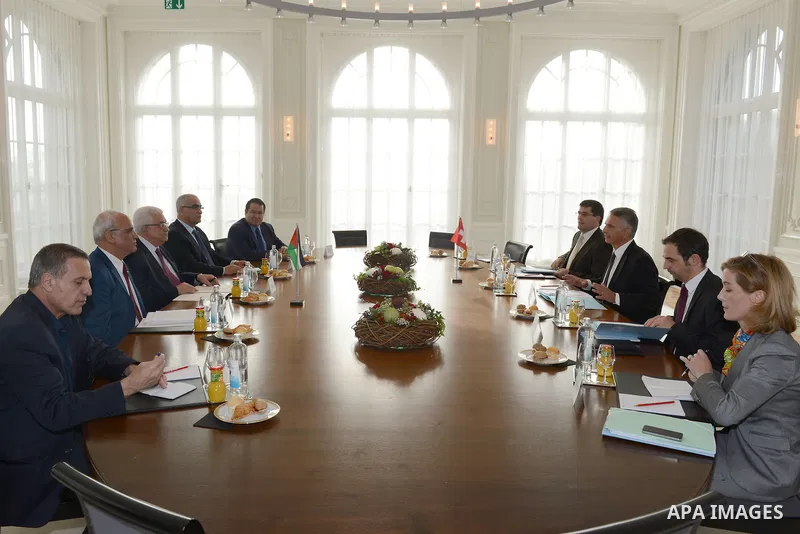 Palestinian President Mahmud Abbas (CL) meets with Swiss Foreign Minister Didier Burkhalter (CR) upon his arrival for an official visit to Switzerland on November 15, 2012 in Bern. Abbas is scheduled to present its bid f...