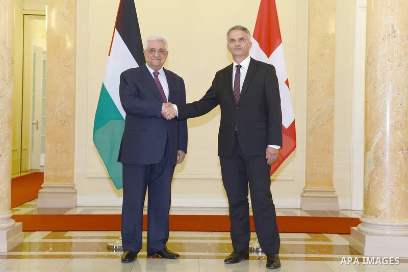 Palestinian President Mahmud Abbas (L) poses with Swiss Foreign Minister Didier Burkhalter (R) upon his arrival for an official visit to Switzerland on November 15, 2012 in Bern. Abbas is scheduled to present its bid for...