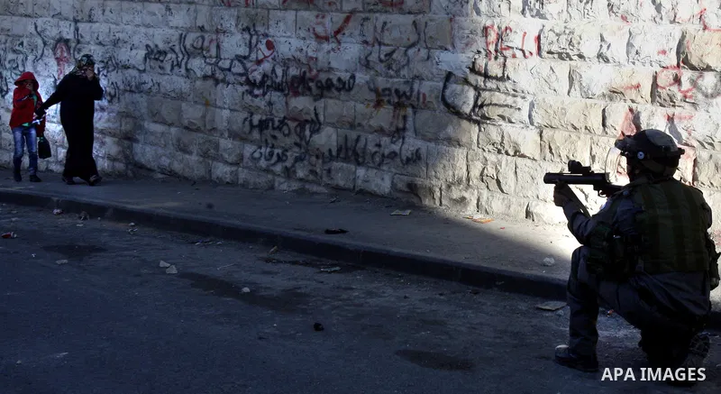 An Israeli security force shot a tear gas canister toward Palestinian demonstrators during clashes in protest to Israel's military operation in Gaza, in the East Jerusalem neighbourhood of Issawiya November 15, 2012. A H...