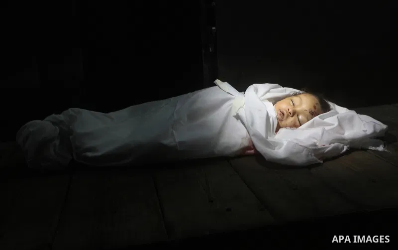 The body of Palestinian baby girl Hanen Tafish who according to hospital officials was killed in an Israeli air strike in Gaza City November 15, 2012. Two rockets fired from the Gaza Strip targeted Tel Aviv on Thursday i...