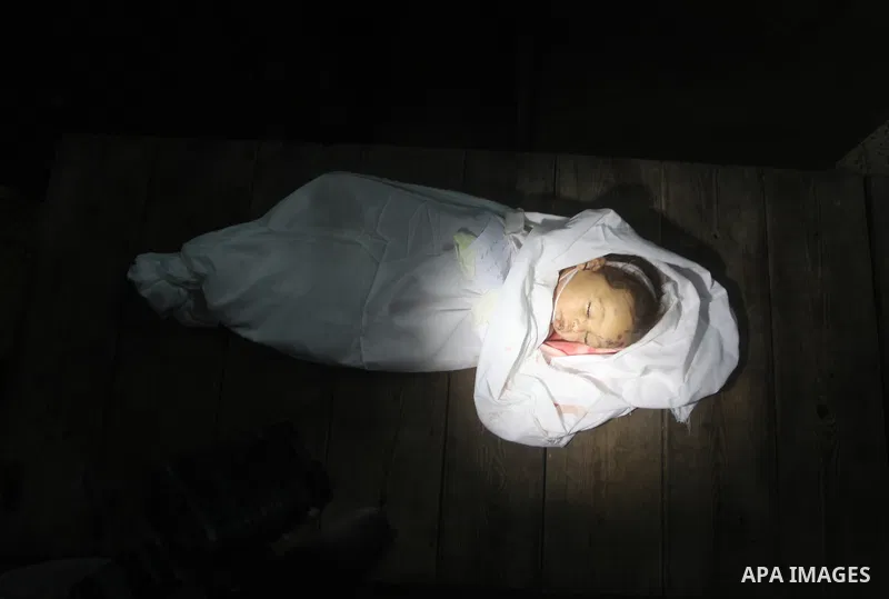 The body of Palestinian baby girl Hanen Tafish who according to hospital officials was killed in an Israeli air strike in Gaza City November 15, 2012. Two rockets fired from the Gaza Strip targeted Tel Aviv on Thursday i...
