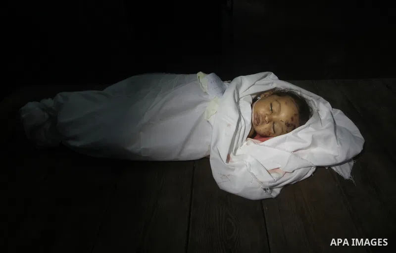 The body of Palestinian baby girl Hanen Tafish who according to hospital officials was killed in an Israeli air strike in Gaza City November 15, 2012. Two rockets fired from the Gaza Strip targeted Tel Aviv on Thursday i...