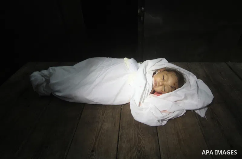 The body of Palestinian baby girl Hanen Tafish who according to hospital officials was killed in an Israeli air strike in Gaza City November 15, 2012. Two rockets fired from the Gaza Strip targeted Tel Aviv on Thursday i...