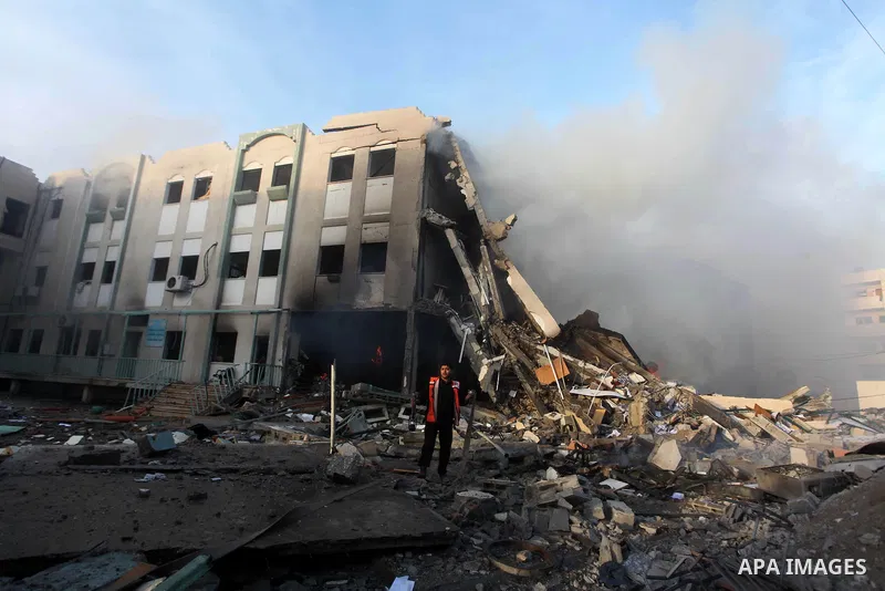 Palestinians inspect the damage in Interior Ministry building after Israeli air strikes in Gaza City, on November 16, 2012. Egypt's prime minister prepared to visit the Gaza Strip on Friday in an unprecedented display of...