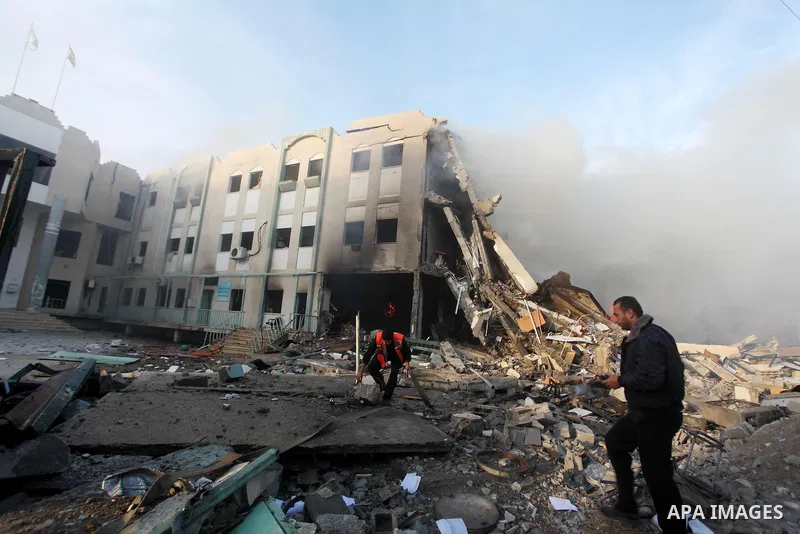 Palestinians inspect the damage in Interior Ministry building after Israeli air strikes in Gaza City, on November 16, 2012. Egypt's prime minister prepared to visit the Gaza Strip on Friday in an unprecedented display of...