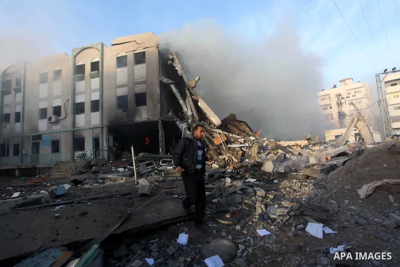 Palestinians inspect the damage in Interior Ministry building after Israeli air strikes in Gaza City, on November 16, 2012. Egypt's prime minister prepared to visit the Gaza Strip on Friday in an unprecedented display of...