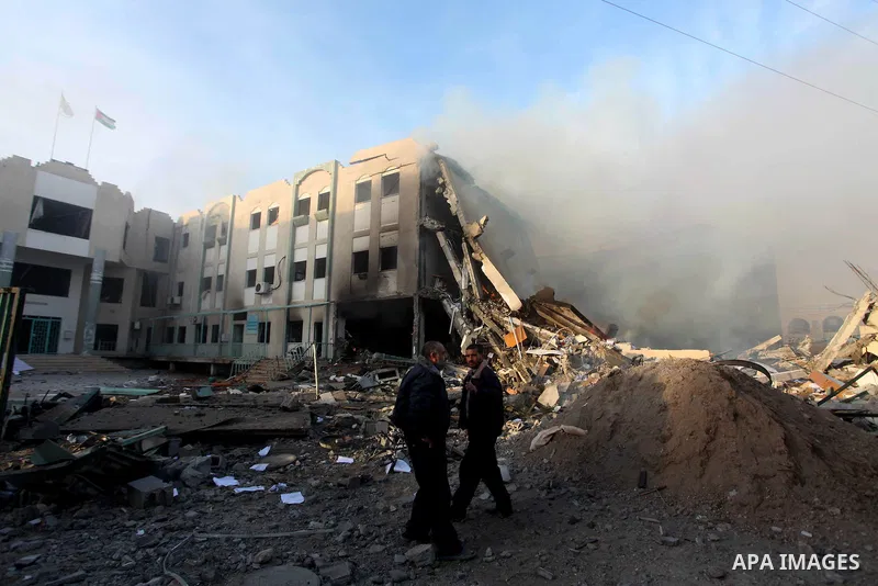 Palestinians inspect the damage in Interior Ministry building after Israeli air strikes in Gaza City, on November 16, 2012. Egypt's prime minister prepared to visit the Gaza Strip on Friday in an unprecedented display of...