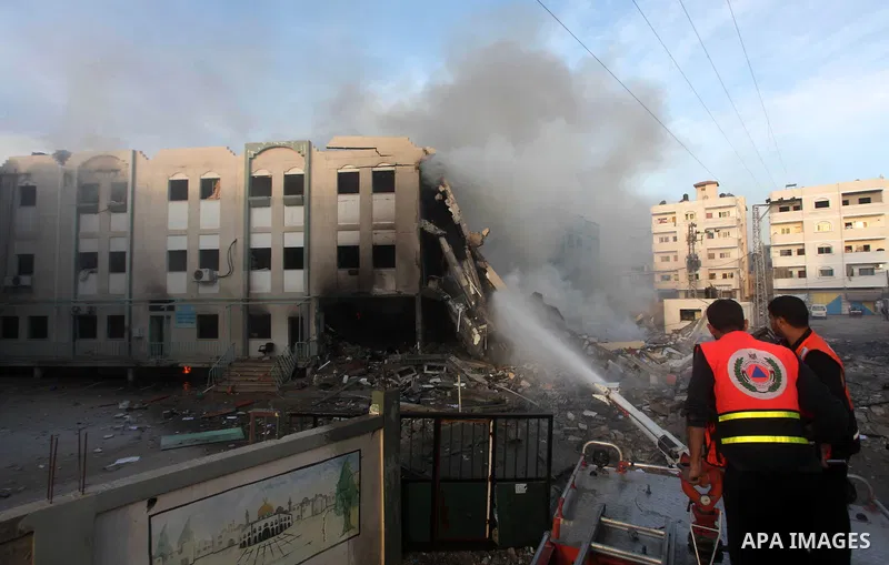 Palestinian firemen extinguish a fire after Israeli air strikes targeted Interior Ministry building in Gaza City, on November 16, 2012. Egypt's prime minister prepared to visit the Gaza Strip on Friday in an unprecedente...
