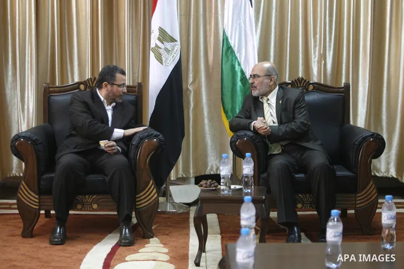 Palestinian Deputy Prime Minister in Gaza strip Ziad al-Zaza (R) recieves the Egyptian Prime Minister Hisham Kandil (L) at Rafah crossing border southern Gaza strip on November 16, 2012. Egypt's Prime Minister visits the...