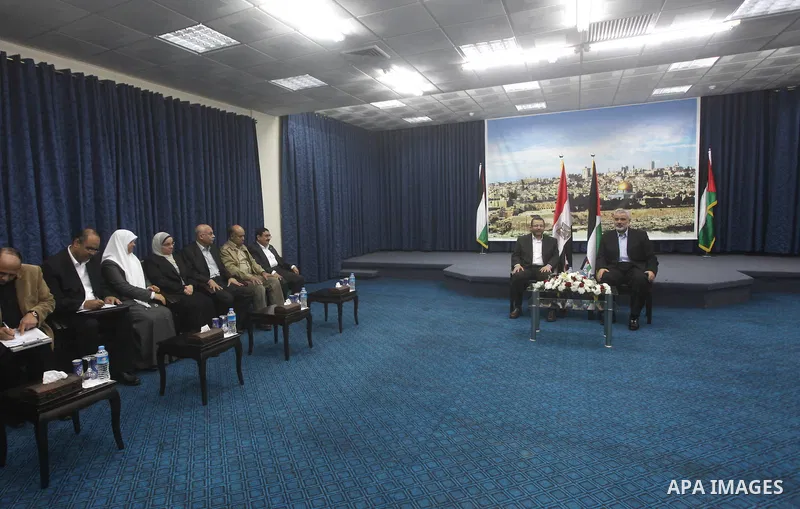 Palestinian Prime Minister in the Gaza Strip Ismail Haniya receives Egyptian Prime Minister Hisham Qandil in Gaza City, on November 16, 2012 . Egyptian premier Hisham Qandil vowed to intensify Cairo's efforts to secure a...