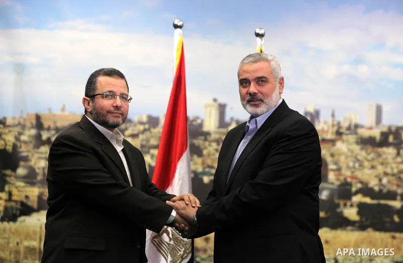 Palestinian Prime Minister in the Gaza Strip Ismail Haniya receives Egyptian Prime Minister Hisham Qandil in Gaza City, on November 16, 2012 . Egyptian premier Hisham Qandil vowed to intensify Cairo's efforts to secure a...
