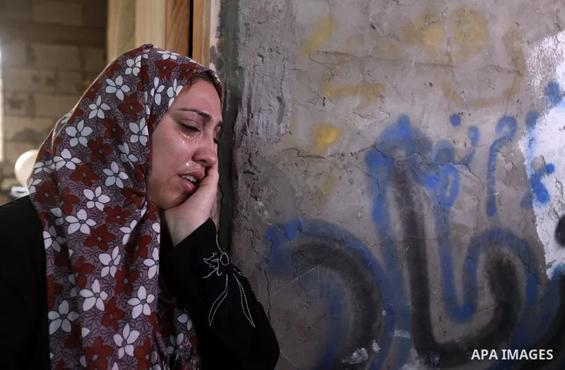 Relatives of 10-month-old Palestinian girl, Hanen Tafesh, killed the day before in an Israeli air strike, react before her funeral in Gaza City, on November 16, 2012. Israeli warplanes carried out multiple new air strike...