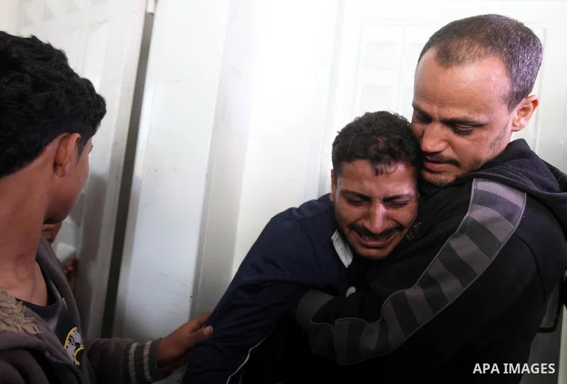 Relatives of 10-month-old Palestinian girl, Hanen Tafesh, killed the day before in an Israeli air strike, react before her funeral in Gaza City, on November 16, 2012. Israeli warplanes carried out multiple new air strike...
