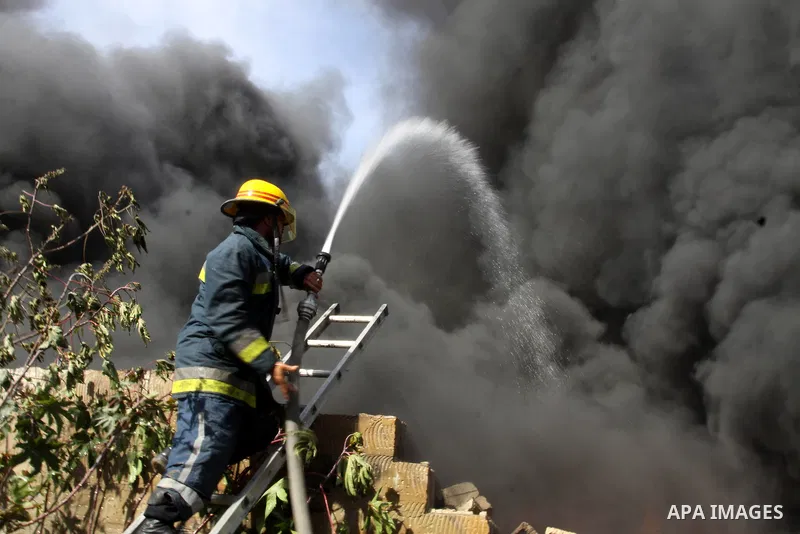 Firefighters try to extinguish a fire in a factory which according to Palestinians was hit by an Israeli air strike in Gaza November 16, 2012. Egyptian Prime Minister Hisham Kandil arrived in the Gaza Strip on Friday to...
