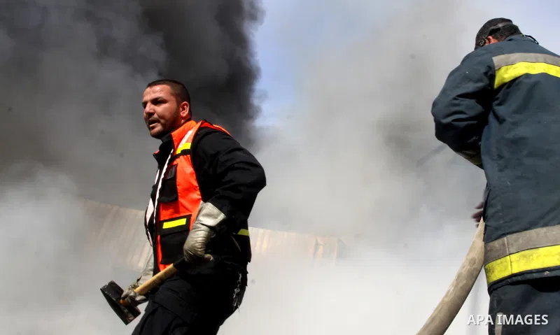 Firefighters try to extinguish a fire in a factory which according to Palestinians was hit by an Israeli air strike in Gaza November 16, 2012. Egyptian Prime Minister Hisham Kandil arrived in the Gaza Strip on Friday to...