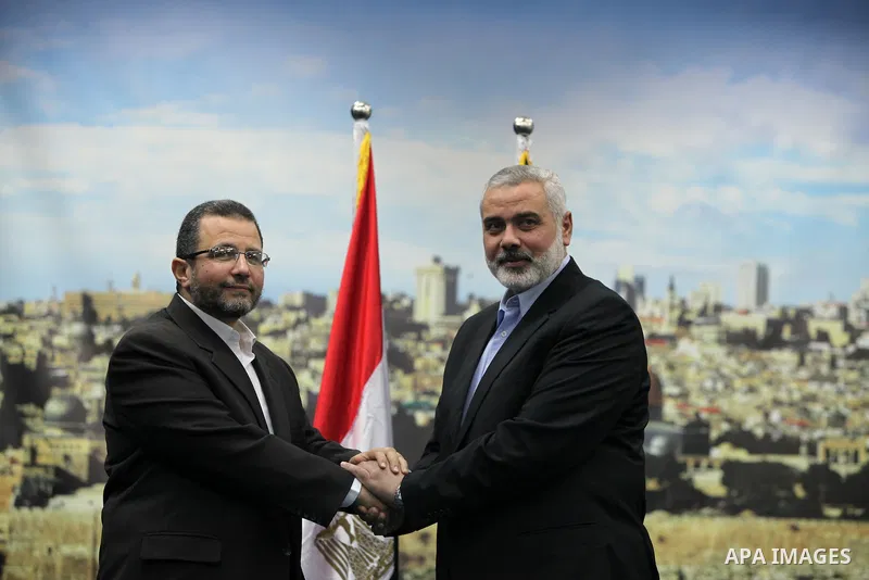 Palestinian Prime Minister in the Gaza Strip Ismail Haniya receives Egyptian Prime Minister Hisham Qandil in Gaza City, on November 16, 2012 . Egyptian premier Hisham Qandil vowed to intensify Cairo's efforts to secure a...
