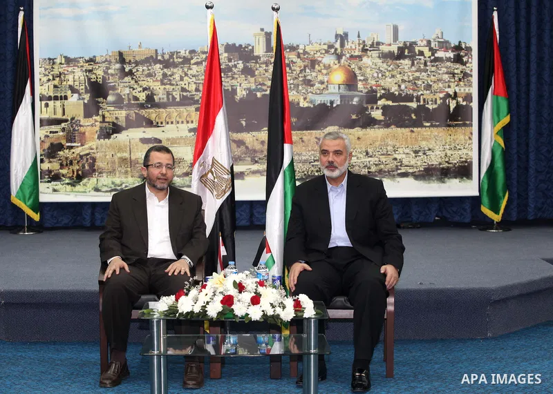Palestinian Prime Minister in the Gaza Strip Ismail Haniya receives Egyptian Prime Minister Hisham Qandil in Gaza City, on November 16, 2012 . Egyptian premier Hisham Qandil vowed to intensify Cairo's efforts to secure a...
