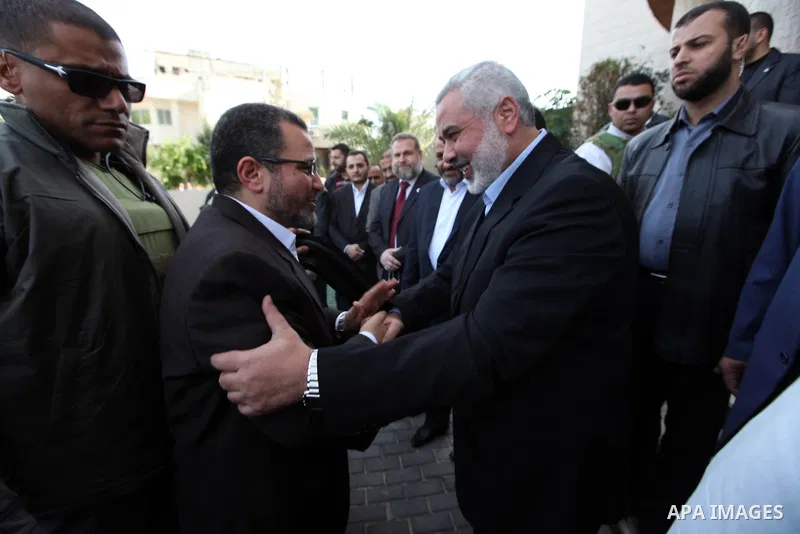 Palestinian Prime Minister in the Gaza Strip Ismail Haniya receives Egyptian Prime Minister Hisham Qandil in Gaza City, on November 16, 2012 . Egyptian premier Hisham Qandil vowed to intensify Cairo's efforts to secure a...