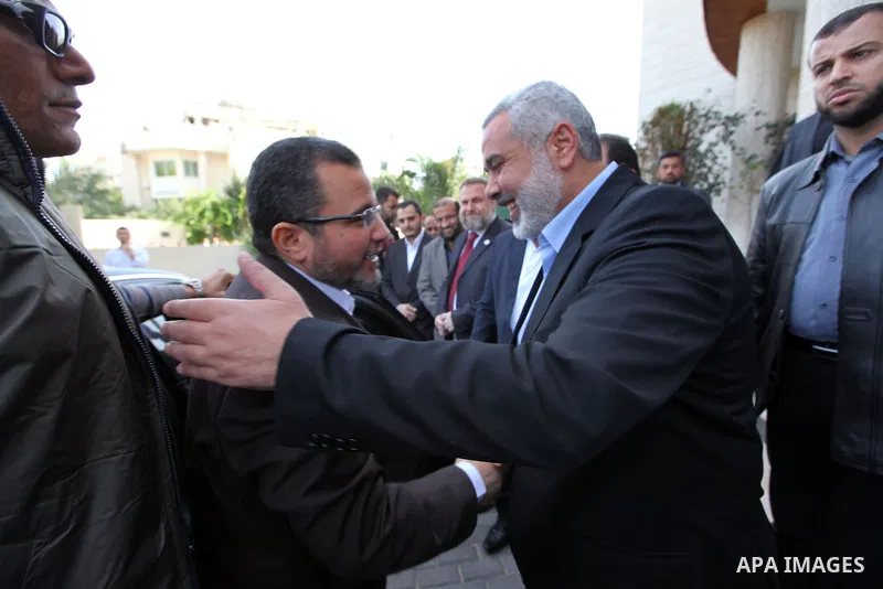 Palestinian Prime Minister in the Gaza Strip Ismail Haniya receives Egyptian Prime Minister Hisham Qandil in Gaza City, on November 16, 2012 . Egyptian premier Hisham Qandil vowed to intensify Cairo's efforts to secure a...