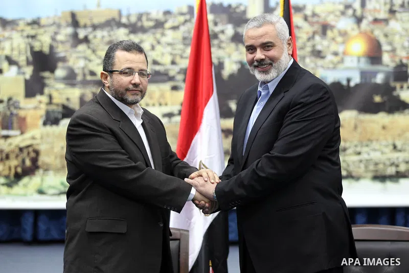 Palestinian Prime Minister in the Gaza Strip Ismail Haniya receives Egyptian Prime Minister Hisham Qandil in Gaza City, on November 16, 2012 . Egyptian premier Hisham Qandil vowed to intensify Cairo's efforts to secure a...