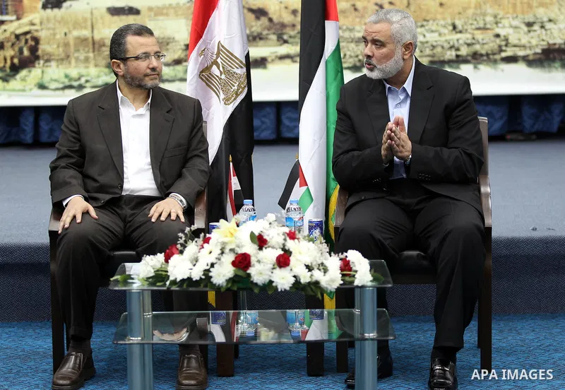 Palestinian Prime Minister in the Gaza Strip Ismail Haniya receives Egyptian Prime Minister Hisham Qandil in Gaza City, on November 16, 2012 . Egyptian premier Hisham Qandil vowed to intensify Cairo's efforts to secure a...