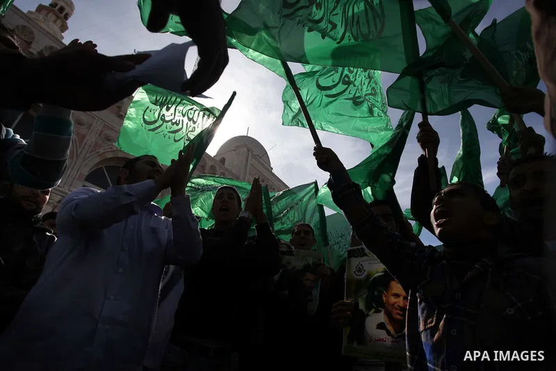 Palestinian Hamas supporters wave flags during a protest against Israel's operations in Gaza Strip, in the West Bank city of Ramallah 16 November 2012. Reports state that missiles continue to be fired on Israeli targets...