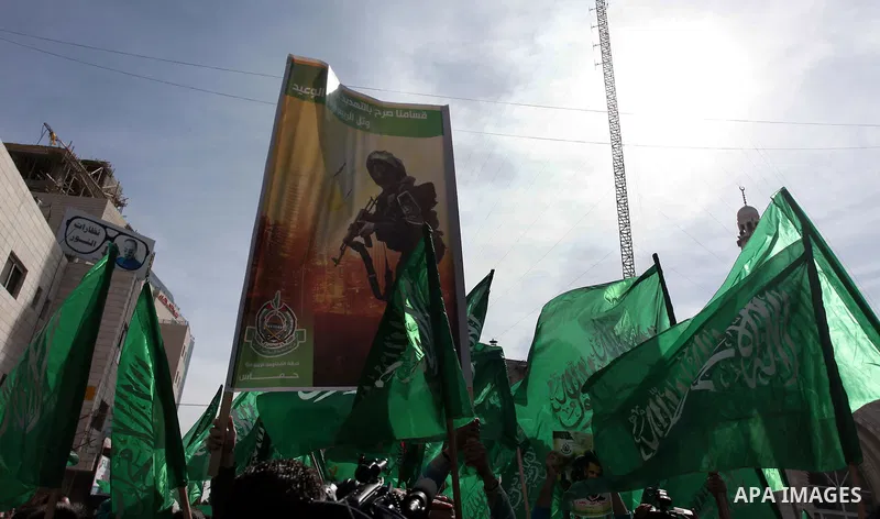 Palestinian Hamas supporters wave flags during a protest against Israel's operations in Gaza Strip, in the West Bank city of Ramallah 16 November 2012. Reports state that missiles continue to be fired on Israeli targets...