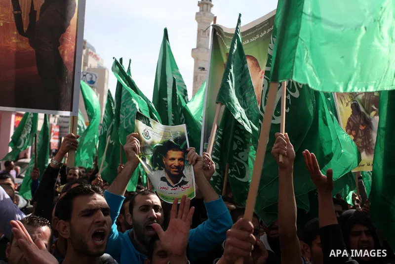 Palestinian Hamas supporters wave flags during a protest against Israel's operations in Gaza Strip, in the West Bank city of Ramallah 16 November 2012. Reports state that missiles continue to be fired on Israeli targets...
