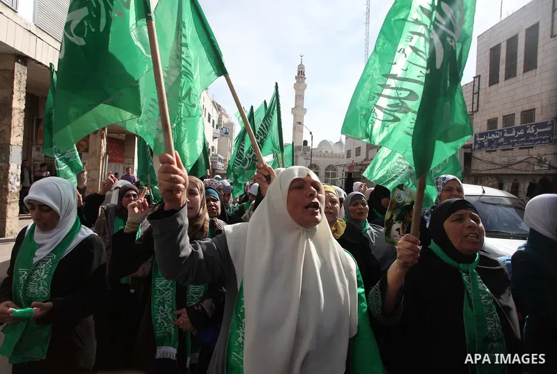 Palestinian Hamas supporters wave flags during a protest against Israel's operations in Gaza Strip, in the West Bank city of Ramallah 16 November 2012. Reports state that missiles continue to be fired on Israeli targets...