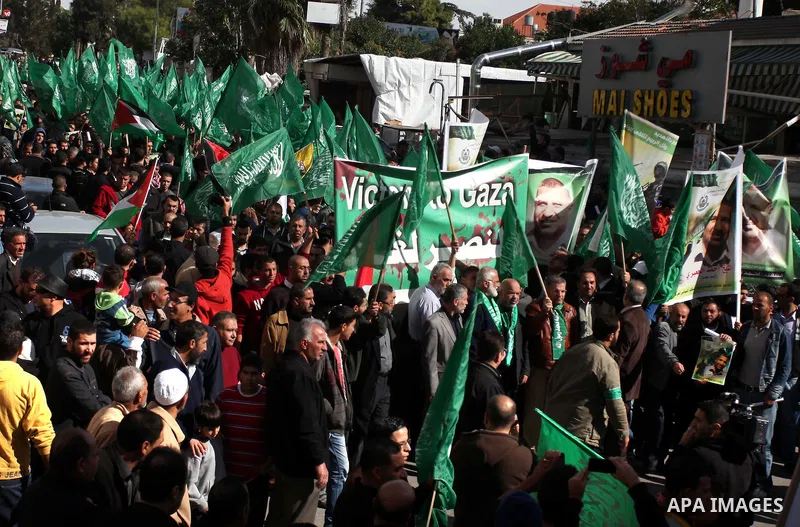 Palestinian Hamas supporters wave flags during a protest against Israel's operations in Gaza Strip, in the West Bank city of Ramallah 16 November 2012. Reports state that missiles continue to be fired on Israeli targets...