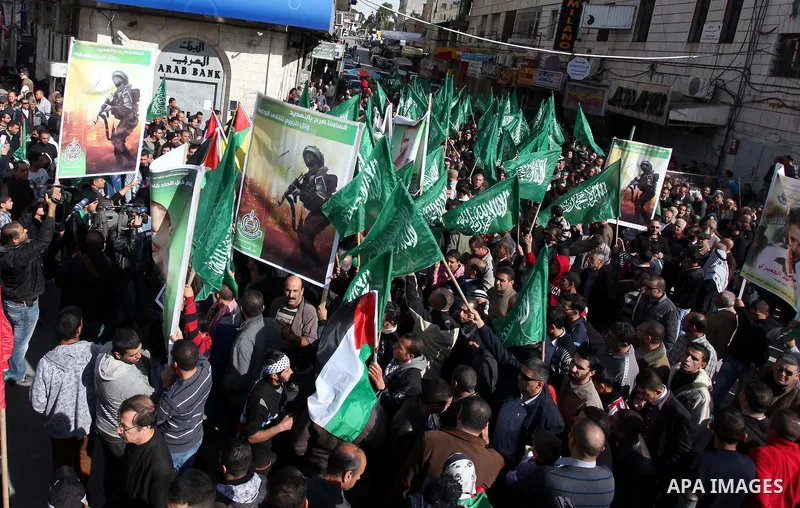 Palestinian Hamas supporters wave flags during a protest against Israel's operations in Gaza Strip, in the West Bank city of Ramallah 16 November 2012. Reports state that missiles continue to be fired on Israeli targets...