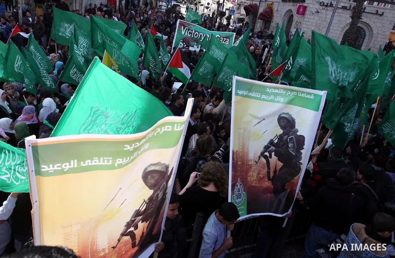 Palestinian Hamas supporters wave flags during a protest against Israel's operations in Gaza Strip, in the West Bank city of Ramallah 16 November 2012. Reports state that missiles continue to be fired on Israeli targets...