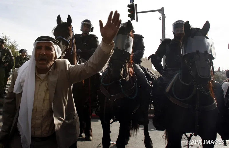 A Palestinian man shouts slogans during a protest in Damascus Gate in Jerusalem's Old City on November 16, 2012 against Israel's military operation in the Gaza Strip. Thousands of angry Palestinians rallied across the We...