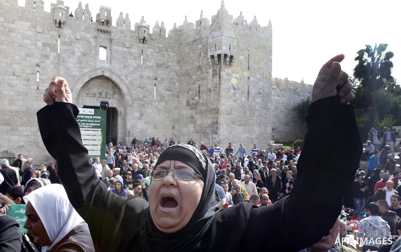 Palestinian protestors gesture and shout slogans during a protest in Damascus Gate in Jerusalem's Old City on November 16, 2012 against Israel's military operation in the Gaza Strip. Thousands of angry Palestinians ralli...