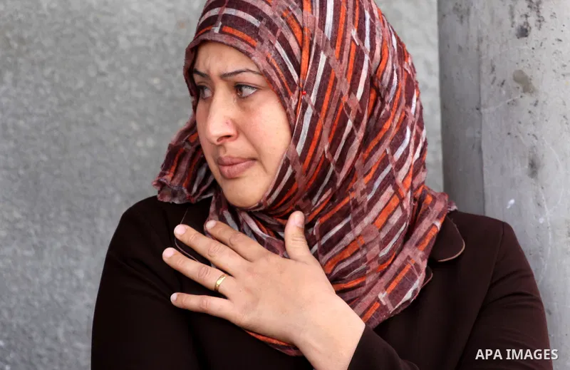 Palestinian women of Audi Naser 10 years, cries during his funeral after he was killed in an Israeli air strike, during his funeral in Beit Hanun, northern Gaza Strip on 16 November 2012. Missiles continue to be fired on...