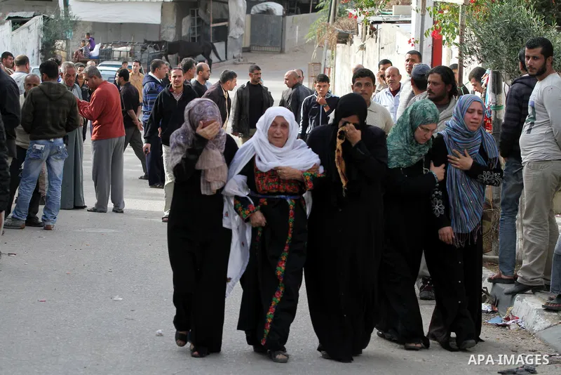 Palestinian women cry during the funeral of Tahrer Salman and Mohammed Salman in Beit Lahia, north Gaza, Friday, Nov. 16, 2012. According to relatives, the two members of the Salman family were killed after an Israeli ai...