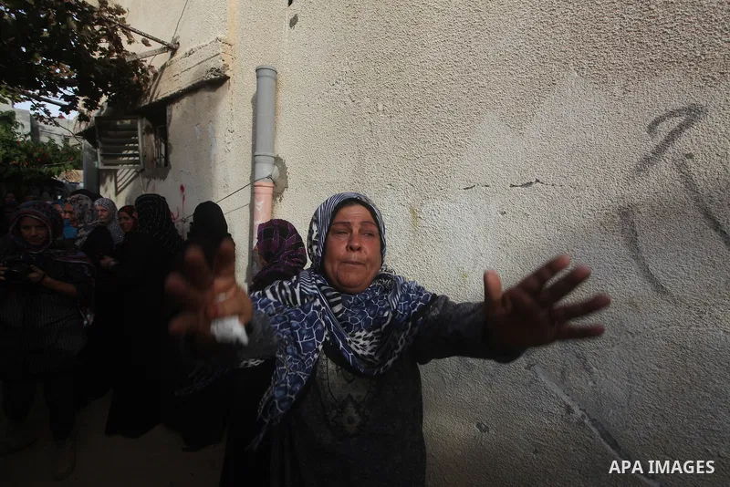 Palestinian women cry during the funeral of Tahrer Salman and Mohammed Salman in Beit Lahia, north Gaza, Friday, Nov. 16, 2012. According to relatives, the two members of the Salman family were killed after an Israeli ai...