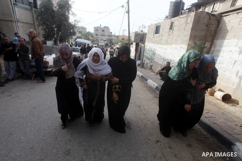 Palestinian women cry during the funeral of Tahrer Salman and Mohammed Salman in Beit Lahia, north Gaza, Friday, Nov. 16, 2012. According to relatives, the two members of the Salman family were killed after an Israeli ai...