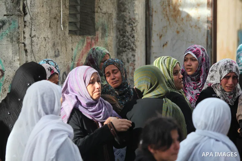 Palestinian women cry during the funeral of Tahrer Salman and Mohammed Salman in Beit Lahia, north Gaza, Friday, Nov. 16, 2012. According to relatives, the two members of the Salman family were killed after an Israeli ai...
