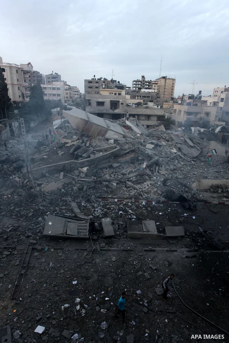Palestinians inspect the destroyed office building of Hamas Prime Minister Ismail Haniyeh in Gaza City November 17, 2012. Israeli aircraft pounded Hamas government buildings in Gaza on Saturday, including the building ho...
