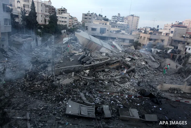 Palestinians inspect the destroyed office building of Hamas Prime Minister Ismail Haniyeh in Gaza City November 17, 2012. Israeli aircraft pounded Hamas government buildings in Gaza on Saturday, including the building ho...